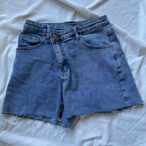 Size small denim jeans with asymmetrical waist detail